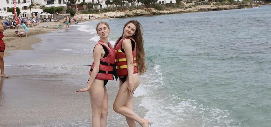 Guests on the beach in life jackets before their ride